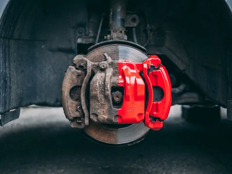 Before or after pair on the same corner — Tint Express caliper painting