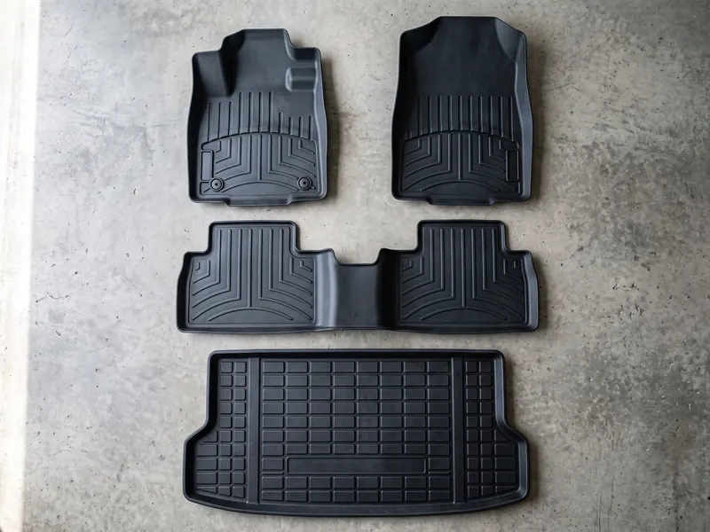 Full set laid out — front, rear, cargo — Tint Express custom floor mats